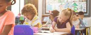 Students in their classroom working at their desks