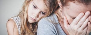 Mom leaning on worried moms shoulder