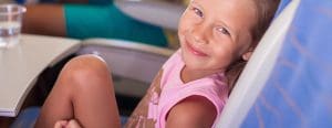 Little girl smiling on plane