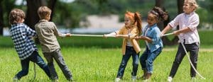 Kids playing tug of war outside