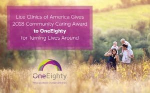 Family on a hike outside with kids on their shoulders