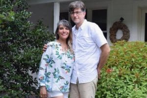 Lice clinic owners pose outside their house in Texas
