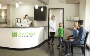 lice clinics of america reception area, friendly technician greeting child